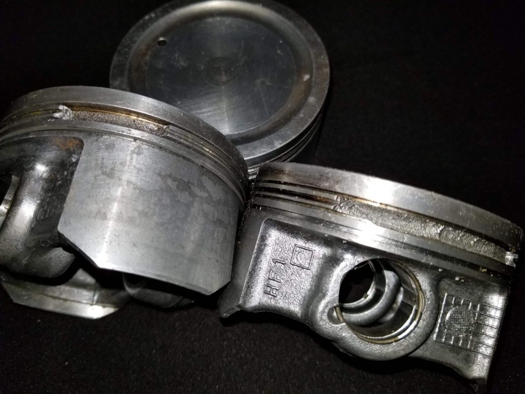Severe detonation from low octane fuel. Usually you can tell it happened very quickly, by just a clean break. The owner probably pinned the throttle, once high boost kicked it the severe detonation completely caused ring lands fracture. Usually this is followed by oil blowing out of the motor into the hull, or a valve cover gasket pushed out blowing oil out.